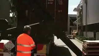 How to unload a shipping container from a side loader truck
