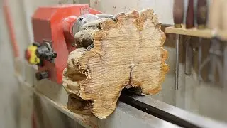Wood turning a slice of Yew.