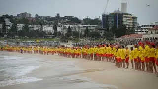 Surf lifesavers honour Bondi victims with two minutes of silence