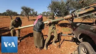Rebel Fighters Fire Rockets at Syrian Regime Forces, Idlib