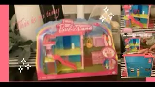 Opening the mini Barbie land-dream house. 