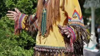 Indigenous dancer wearing traditional clothing during Latin American festival