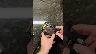 Loading Kodak Portra 400 135 film into a Vivitar V3000s SLR camera