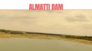 Train Crossing Bridge in Front of Almatti Dam