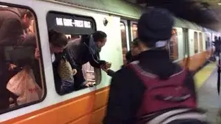Riders escape through windows after train's motor overheats at Back Bay station