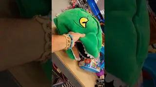 Looks like a Rugrats Reptar Halloween mask🤔