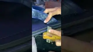 This is a small special tool that is being used to cut a sandal