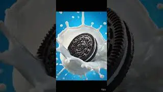 Oreo cookie being dunked into cold milk, splash and droplets frozen mid-motion.