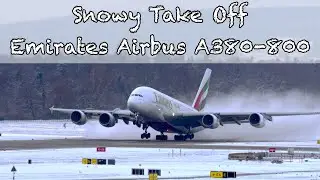 Zurich Airport Emirates airplane Airbus A380-800 A6-EEB taking off on a snowy winter day.