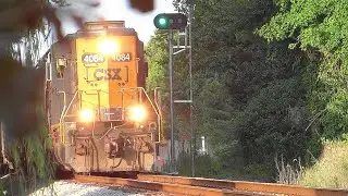 An EMD SD40-3 Leads Long Hood Forward on Mixed Freight Train