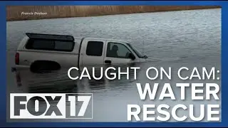 WATCH: Bystanders use rowboat to rescue victim who accidentally drove into pond