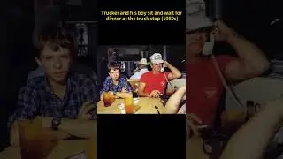 Trucker and his boy sit and wait for dinner at the truck stop 1980s