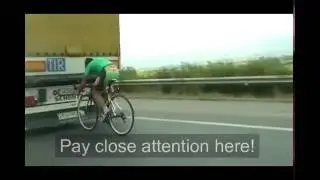 Drafting cyclist going extremely fast and dangerously close right behind a large truck