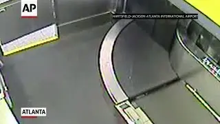 Toddler takes wild ride on airport luggage belt