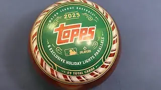 Having 2 little helpers open up a Topps Holiday Ornament 