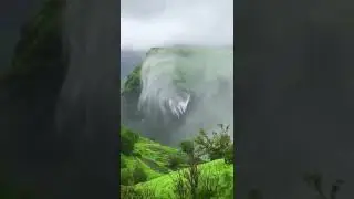 Strong winds blowing away a waterfall
