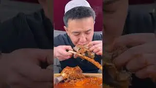Chinese boy eating delicious boiled lamb meat beef hoof  with spicy Hot red chilli garlic sauce 🔥🔥🔥🔥