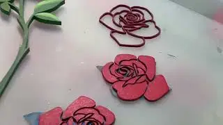 Maggie, the Artsy Artisan working on inlaid roses, part of her blooming 