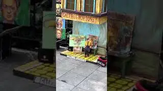 Artist uses puppet to paint