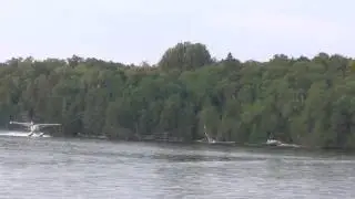 Cessna 180B on floats overhead take off