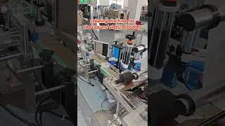 Labeling machine for the top and sides of bottles.