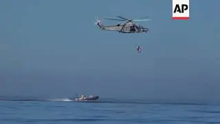 Italian Coast Guard rescue ailing migrant woman