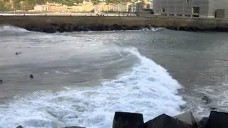 Surfing into the San Sebastian river mouth in Spain