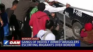 Gangs of heavily armed smugglers escorting migrants over border