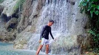 Enjoying the waterfall in the village when it rains