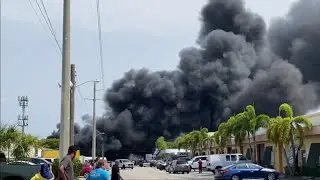 Foam manufacturing warehouse catches fire sending black smoke billowing into the air