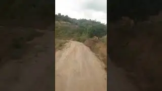 A bus climbing a very high hill.