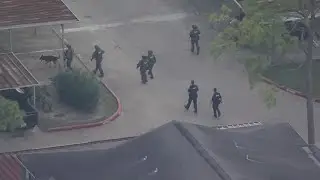 Neighborhood on edge as armed search follows deadly METRO bus shooting