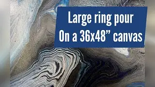 Large ring pour on a 36x48&rdquo; canvas | black, silver, blue and white colors | fluid art process