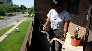 throwing a burnt telephone book off the balcony