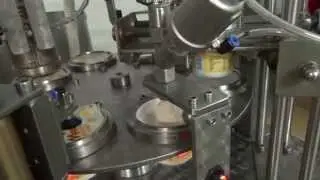AUTOMATIC CAROUSEL MACHINE FOR DOSING AND CLOSING