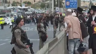 Shooting attack at Jerusalem bus stop kills 6 as tensions remain high in Gaza, AP Explains