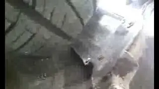 A Chevy Aveo driving over a Sonim Bolt phone, taken from the phone.