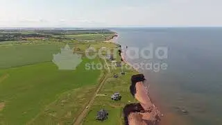 Drone flight over PEI beachfront properties stock video. Summer in Prince Edward Island Canada. 4K.
