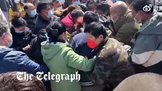 Shanghai residents fight over food supplies amid strict Covid lockdown