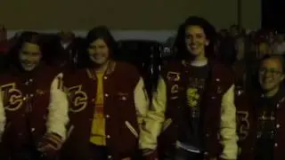 Indian Creek Redskins football team escorted to the stadium by the Creek war drummers.