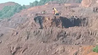 Iron ore mining at hilltop, Operation of poclain, Dumper,loader and drill,