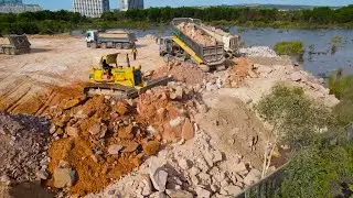 Nice Working Equipment Bulldozer Push Big Stone and Dump Truck Unloading Stone into Water