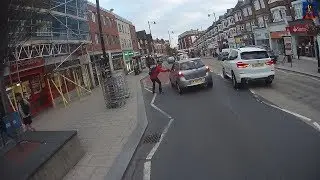 Pedestrian Walks Across the Road on a Red Man
