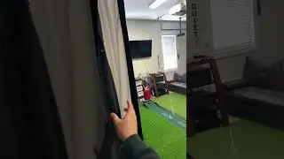 Curtains behind net to make golf sim screen pop more!
