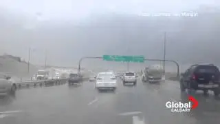 INCREDIBLE FOOTAGE Sign blowing around on Deerfoot