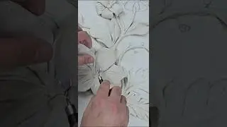 Making a bas-relief from clay