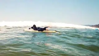 Learning how to surf in Pismo Beach, California