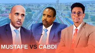 Doodda Cabdi Maxamuud Cumar Iyo Mustafe Muxumed Cumar Iyo Taageerayaashooda ka dhex taagan.