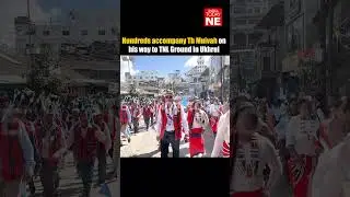 Сотни людей сопровождают Тха Муйву по пути на стадион TNL в Ухруле.