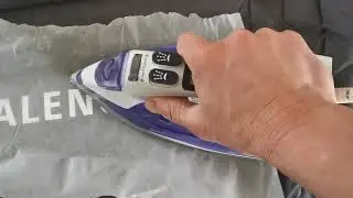 Ironing on Balenciaga Logo on old puffer jacket. Successfully !